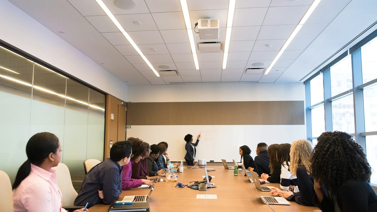 Colleagues in a conference room during a client meeting